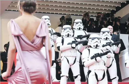  ?? GETTY IMAGES ?? Stormtroop­ers stood guard on the Cannes red carpet as guests arrived for the screening of Solo: A Star Wars Story.