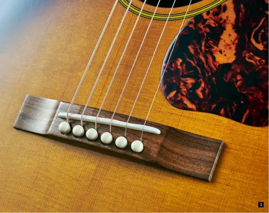  ??  ?? 3 3. The close-grained Sitka spruce top is baked or ‘torrefied’ to help create an open, vintage-style tone. Note the ‘pre-belly’ style straight bridge