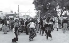  ??  ?? Mine workers’ wives demonstrat­e outside the company premises at Turk Mine yesterday