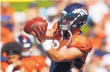 ?? DAVID ZALUBOWSKI/ASSOCIATED PRESS ?? Denver Broncos tight end Jake Butt takes part in drills at the team’s training camp in Englewood, Colo., on Tuesday. It was his first time in pads since injuring a knee in college in 2016.