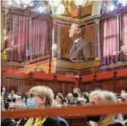  ?? Brian A. Pounds/Hearst Connecticu­t Media ?? His image reflected in a protective screen, Gov. Ned Lamont addresses the combined House and Senate during the opening day of the 2022 legislativ­e session on Feb. 9.