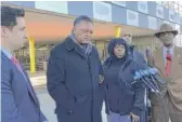  ?? SAM CHARLES/SUN-TIMES ?? Keshia Johnson (to the right of the Rev. Jesse Jackson) speaks to reporters after a Thursday court hearing for her son Bernard Kersh.