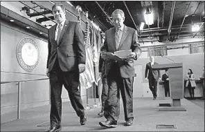  ?? AP/JACQUELYN MARTIN ?? Judiciary Committee Chairman Robert Goodlatte (right) and Rep. Raul Labrador, the panel’s border security subcommitt­ee chairman, leave a news conference Wednesday after unveiling a House immigratio­n bill that would cut legal immigratio­n by 25 percent,...