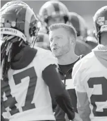  ?? JOHN BAZEMORE/AP ?? Los Angeles Rams coach Sean McVay huddles with his players during practice Friday ahead of the Super Bowl in Atlanta.