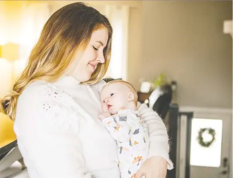 ?? MATT SMITH ?? Brittany Caffet cuddles her seven-week-old son Henry. The infant has a heart condition that puts him at grave risk if he catches the flu.