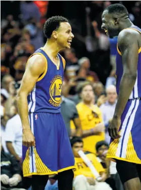  ?? Scott Strazzante / The Chronicle ?? The Warriors' Stephen Curry and Draymond Green excitedly come together during the waning moments of Game 6 to celebrate the team’s championsh­ip.