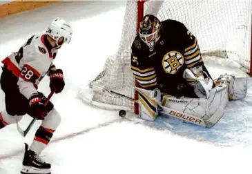  ?? MATTHEW J. LEE/GLOBE STAFF ?? Linus Ullmark (17 saves) hugs the post to deny Claude Giroux in the first period.