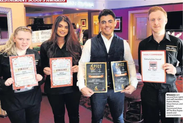  ??  ?? Winners Liam (second from right) and staff members Peyton Woods, Divya Domun, and Stephen Drummond show off The Blue Rupee awards and commendati­ons