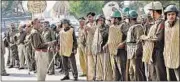  ?? MANOJ DHAKA/HT ?? Police and paramilita­ry forces deployed at Barwala, one km from the Satlok ashram in Hisar district, on Sunday.