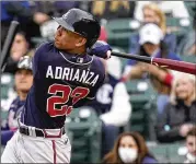 ?? NAM Y. HUH/ASSOCIATED PRESS ?? Ehire Adrianza hits a solo home run during the Braves’ six-run first inning Sunday night against the Cubs. Apart from Ronald Acuna Jr., the Braves’ bench has been the best part of the 2021 team.