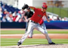  ?? Associated Press ?? n RED SOX 5, ASTROS 5. Boston Red Sox starting pitcher Chris Sale works Monday during the second inning of a spring training game against the Houston Astros in West Palm Beach, Fla.