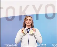  ?? Laurence Griffiths / TNS ?? Katie Ledecky displays her two gold and two silver medals after a news conference during the Tokyo Olympic Games on July 31 in Tokyo.