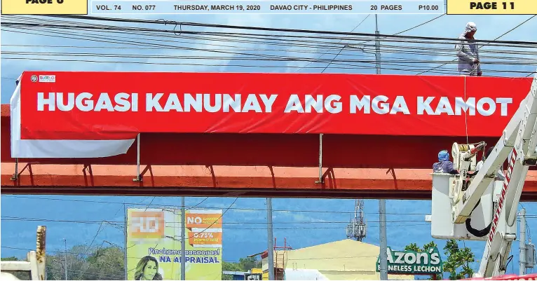  ??  ?? A HUGE tarpaulin greets motorists and commuters at the pedestrian overpass along MacArthur Highway in Bangkal, Davao City on Wednesday, reminding the public to wash their hands frequently as a preventati­ve measure against COVID-19. BING GONZALES