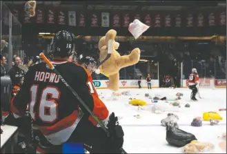  ?? NEWS PHOTO RYAN MCCRACKEN ?? Medicine Hat Tigers forward Corson Hopwo watches stuffed animals soar over the boards during his team’s Medicine Hat News Teddy Bear Toss game against the Saskatoon Blades at what is no Co-op Place on Saturday, Nov. 30, 2019. A special Teddy Bear Toss will be held in the Co-op Place parking lot from 2-4 p.m. Sunday.