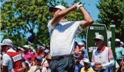  ?? Seth Wenig/Associated Press ?? Scottie Scheffler hits off the first tee during the third round of the Travelers Championsh­ip at TPC River Highlands in Cromwell in 2022. Scheffler, the world’s No. 1 golfer, has committed to play in the 2024 event.