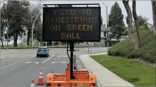  ?? COURTESY OF ROGER GREGSTON ?? This sign, at Serrano Road and Toledo Way in Lake Forest, caught the full attention of a reader who wondered what it meant. Green ball refers to the standard round, green light on a traffic signal.