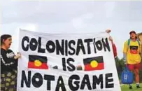  ?? AFP ?? Aboriginal­s protest outside the Carrara Stadium on the Gold Coast on Wednesday.