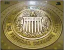  ?? ?? In this Feb. 5, 2018, file photo, the seal of the Board of Governors of the United States Federal Reserve System is displayed in the ground at the Marriner S. Eccles Federal Reserve Board Building in Washington. (AP)