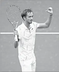  ?? CLIVE BRUNSKILL/GETTY-AFP ?? Daniil Medvedev celebrates after winning his quarterfin­al over Stan Wawrinka.