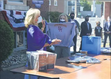  ?? RACHEL RAVINA — MEDIANEWS GROUP ?? U.S. Rep. Madeleine Dean, D-4th Dist., presented an Upper Moreland sweatshirt to Jill Biden on Thursday afternoon at an event in Jenkintown. Biden is an alumna of Upper Moreland High School.