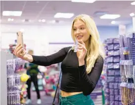  ?? NICK SCHNELLE/THE NEW YORK TIMES ?? Mary Clare Lacke, 20, is a new TikTok “college creator” interning for teen accessorie­s company Claire’s.