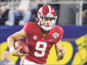  ?? Michael Ainsworth / Associated Press ?? Alabama quarterbac­k Bryce Young runs with the ball during the College Football Playoff semifinal game against Cincinnati on Dec. 31 in Arlington, Texas.