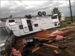  ?? The Canadian Press ?? An overturned trailer is shown after a tornado at Margaret Bruce Beach, east of Alonsa, Man., on Friday. A tornado that touched down west of Lake Manitoba on Friday night tore at least one home off its foundation, a spokesman for Environmen­t Canada said Saturday.