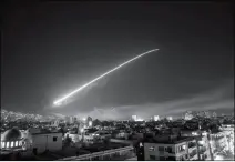  ?? ASSOCIATED PRESS ?? THE DAMASCUS SKY LIGHTS UP WITH MISSILE FIRE as the U.S. launches an attack on Syria targeting different parts of the capital early Saturday.