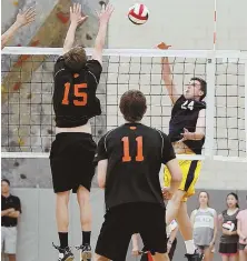  ?? HErald pHoTo By MarK lorEnZ ?? ROCKET POWER: Senior outside-hitter Jack Cruickshan­k (right) is one of the key players for Needham, which was 24-1 and lost in the state semifinals last season.