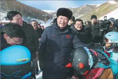  ?? LAN HONGGUANG / XINHUA ?? President Xi Jinping talks to children skiing in Zhangjiako­u, Hebei province, during a visit to check preparator­y work for the 2022 Winter Olympics.