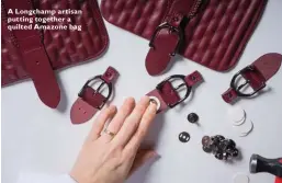  ??  ?? A Longchamp artisan putting together a quilted Amazone bag