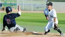  ?? BRUCE EDWARDS/EDMONTON JOURNAL ?? Lethbridge Bulls’ Justin Clarkson is safe as Edmonton Prospects infielder Derek Shedden tries to field the ball.