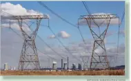  ??  ?? SIPHIWE SIBEKO/REUTERS Electricit­y pylons are seen near cooling towers of South African petrochemi­cal company Sasol’s synthetic fuel plant in Secunda, north of Johannesbu­rg in South Africa, on May 20, 2018.