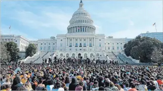  ?? LEIGH VOGEL NYT ?? Above, people at a memorial in Texas after a mass shooting. But gun sales are up. At left, students march in support of gun control.