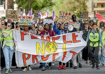  ?? GETTY IMAGES ?? The ‘‘people not profit’’ message has been a familiar one in climate protests, but the world needs to confront what that actually means in terms of economic growth, argues Deirdre Kent.