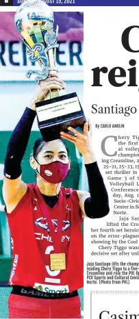  ??  ?? Jaja Santiago lifts the championsh­ip trophy after leading Chery Tiggo to a five-set victory over Creamline and rule the PVL Open Conference at the PCV Sports and Cultural Center in Bacarra, Ilocos Norte. (Photo from PVL)