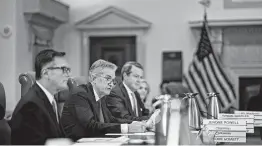  ?? Andrew Harrer / Bloomberg ?? Jerome Powell, chairman of the U.S. Federal Reserve, center, with vice chairmen Richard Clarida, left, and Randal Quarles, have their work cut out for them.