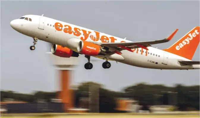  ??  ?? LESQUIN, France: An aircraft of British low-cost airline EasyJet takes off from Lille Airport in Lesquin, northern France on August 25, 2017. —AFP