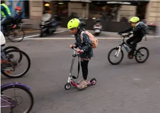  ?? ?? Scooters are welcoming in the bike bus too. NACHO DOCE/REUTERS