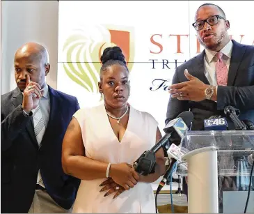  ?? CURTIS COMPTON / CCOMPTON@AJC.COM ?? Attorneys L. Chris Stewart (left) and Justin Miller address the media Wednesday with Tomika Miller. Justin Miller asked that people remember that Rayshard Brooks was a fellow human being.