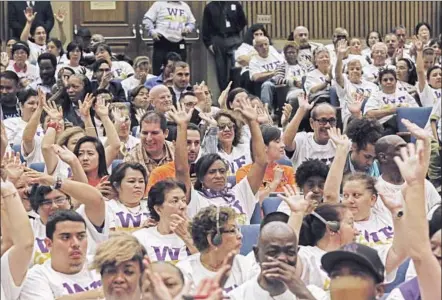  ?? Photog raphs by Anne Cusack Los Angeles Times ?? PEOPLE SHOW THEIR SUPPORT after the L.A. County Board of Supervisor­s voted Tuesday to develop a plan to distribute Truvada, a controvers­ial medication for HIV prevention, to residents who are at high risk of contractin­g the virus.