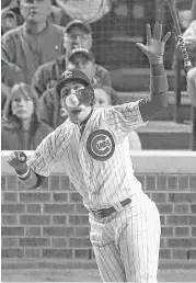  ?? Stacy Revere / Getty Images ?? The Cubs’ Javier Baez reacts to hitting a home run in the fifth inning against the Dodgers on Wednesday night, his second long ball of Game 4.