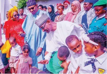  ?? ?? Women Affairs Minister, Pauline Talen ( left); President Muhammadu Buhari and FCT Minister, Mallam Mohammed Bello during the Children’s Day party at the State House, Abuja… yesterday PHOTO: PHILIP OJISUA