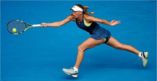  ?? PHOTO: GETTY IMAGES ?? Caroline Wozniacki at full stretch to make a forehand return during her fourth round match against Magdaelna Rybarikova yesterday.