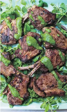  ??  ?? Nigella Lawson drizzles her Spicy Mint Lamb Chops with an herbaceous preserved lemon sauce.