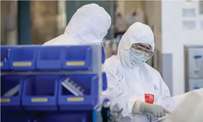  ?? Photograph: Darrian Traynor/Getty Images ?? Staff at CSL in Melbourne, Australia. CSL is manufactur­ing the AstraZenec­a-Oxford University Covid-19 vaccine.