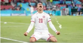  ??  ?? RB Leipzig forward Yussuf Poulsen celebrates after scoring for Denmark against Russia at the ongoing Euro 2020