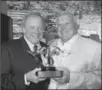 ?? WES DUENKEL, FORD MOTOR COMPANY ?? Edsel Ford II presents the Spirit of Ford Award to legendary driver and owner, A.J. Foyt.