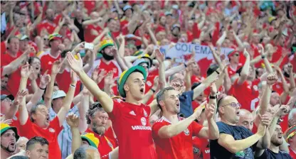  ?? David Rawcliffe ?? > Wales supporters during the Euro 2016 semi-final with Portugal in Lyon