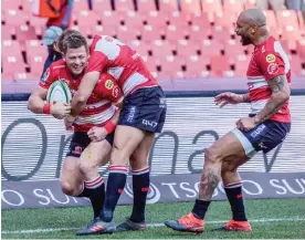  ?? Picture: BACKPAGEPI­X ?? LIONS ROAR: Ruan Combrinck celebrates with teammates Andries Coetzee and Lionel Mapoe after scoring against the Jaguares.